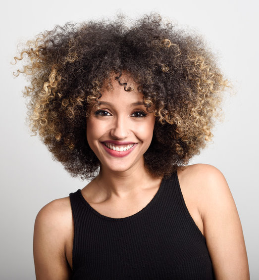 Young black woman with afro hairstyle smiling