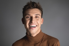 Laughing young man with attractive smile