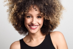 Young black woman with afro hairstyle smiling